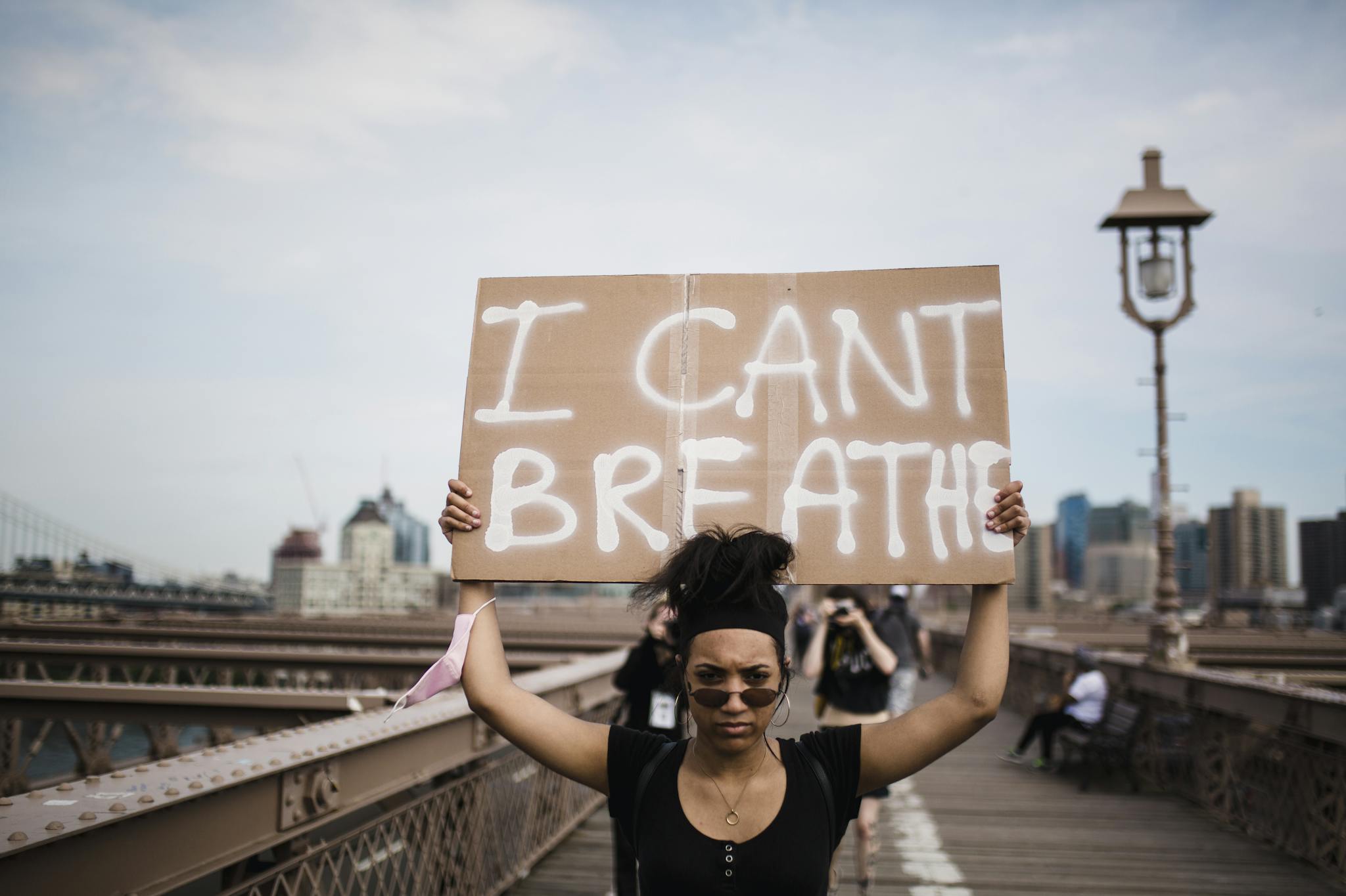 Photo Of Woman Carrying A Cardboard